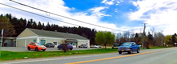 The new commercial building will be south of the existing one, behind the blue truck North Triphammer Road