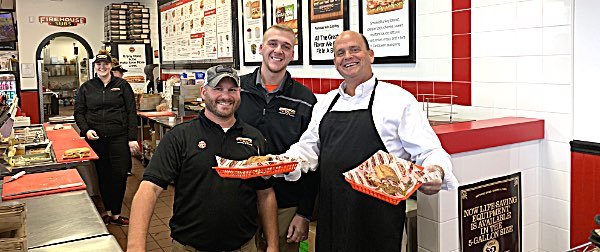 Congressman Tom Reed (right) visited Ithaca Wednesday to make sandwiches at Firehouse Subs, with owner Jamie Mullen (left) and General Manager Christian McCarty (center) Congressman Tom Reed