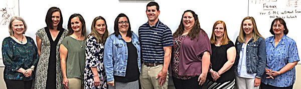 Left to right: Retiree Judy Vaughan; newly tenured teachers Kerry Glenn Keough, Marlo Weaver, Danielle Loveless, Amy Phanhthalath, Brett Hotchkiss, Danielle Hamilton, Laura Larkin, Amanda McGonagle; retiree Emily Tvaroha Lansing tenured teachers and retirees