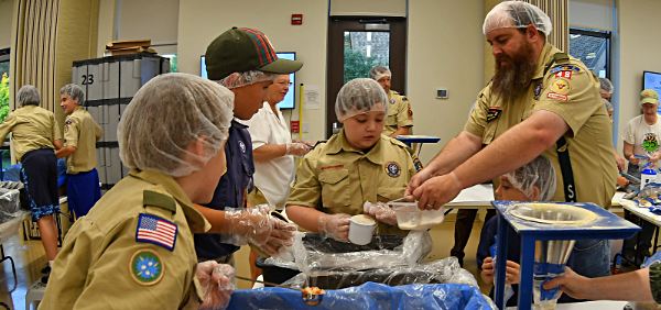 Cubs from Lansing Pack 48 and Scouts from Lansing Troop 48 working together scouts FMSC6