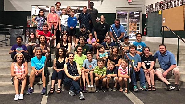 Cayuga Lake Seido Karate and Lansing Summer Lunchbox volunteers pack boxes at the Community Recreation Center. summerlunchbox 2089