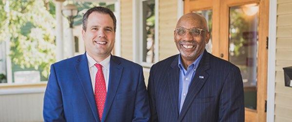 Jason Moore (left) with James Brown uw moore brown