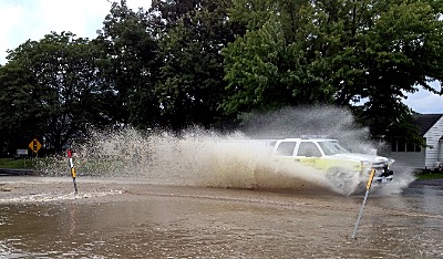 Emergency vehicles were hampered as they responded to flooding emergencies last August. flood firevehicle400