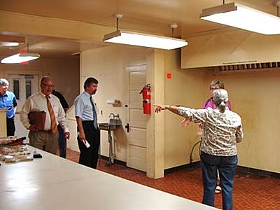 Town Council tours gutted kitchen earlier this month tcc_council