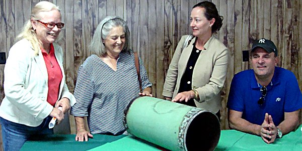At a 2014 NYSEG presentation at the Freeville Fire Station (left to right) former Dryden Town Supervisor Mary Ann Sumner, Former Lansing Town Supervisor Kathy Miller, Tompkins County Area Development Vice President & Director of Economic Development Services Heather McDaniel, Tompkins County Legislator Mike Sigler got a look at a section of ten inch steel pipe that would have been used to bring natural gas to Lansing via West Dryden Road if the natural gas delivery pipeline project had gone forward pipeline section 600